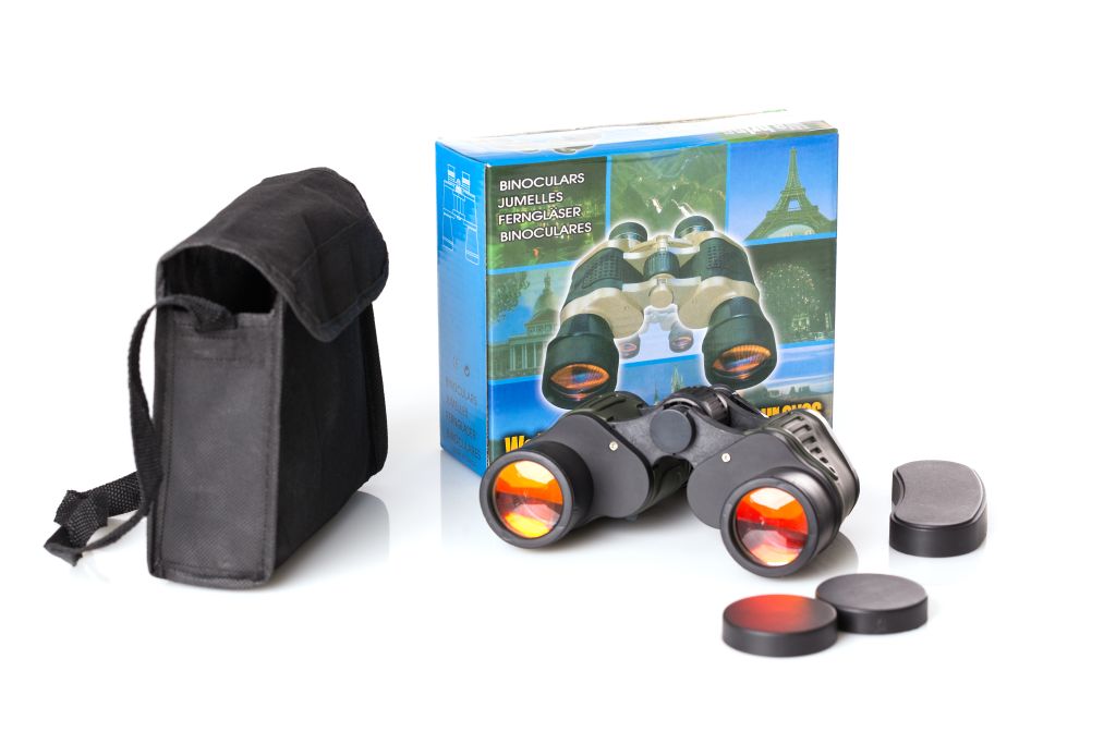 Children's binoculars with carrying case and packaging on a white background